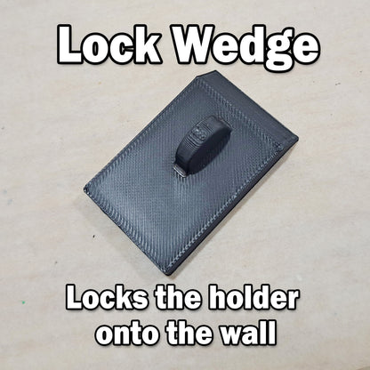 Black lock wedge on a textured surface with text describing its function.